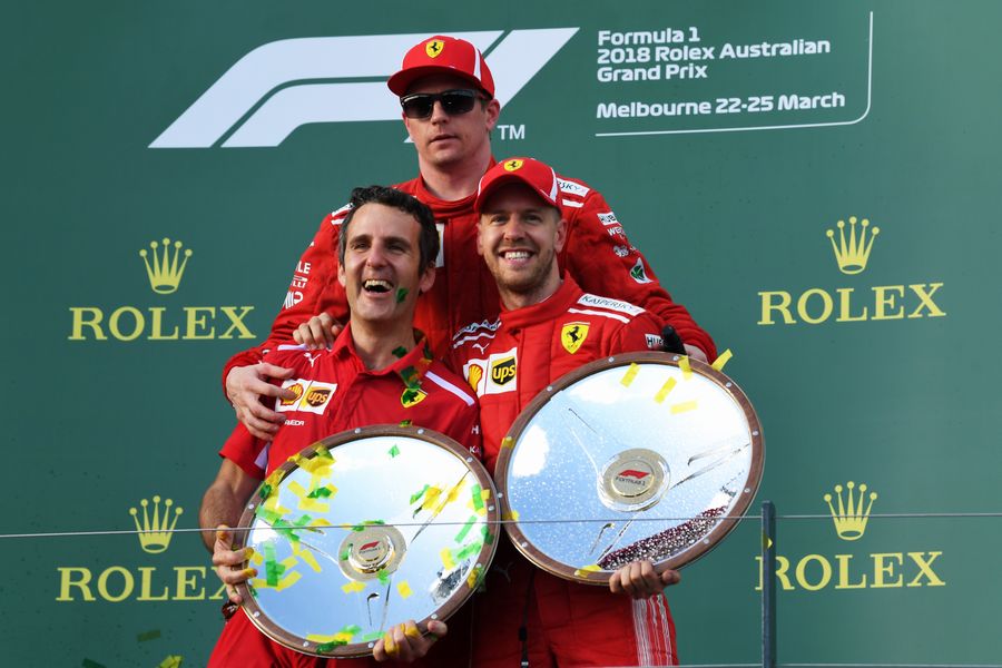 www.sutton-images.com Race winner Sebastian Vettel (GER) Ferrari celebrates on the podium with Kimi Raikkonen (FIN) Ferrari and the trophies at Formula One World Championship, Rd1, Australian Grand Prix, Race, Melbourne, Australia, Sunday 25 March 2018.